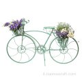 modello di bici da campagna con cesto di fiori a terra